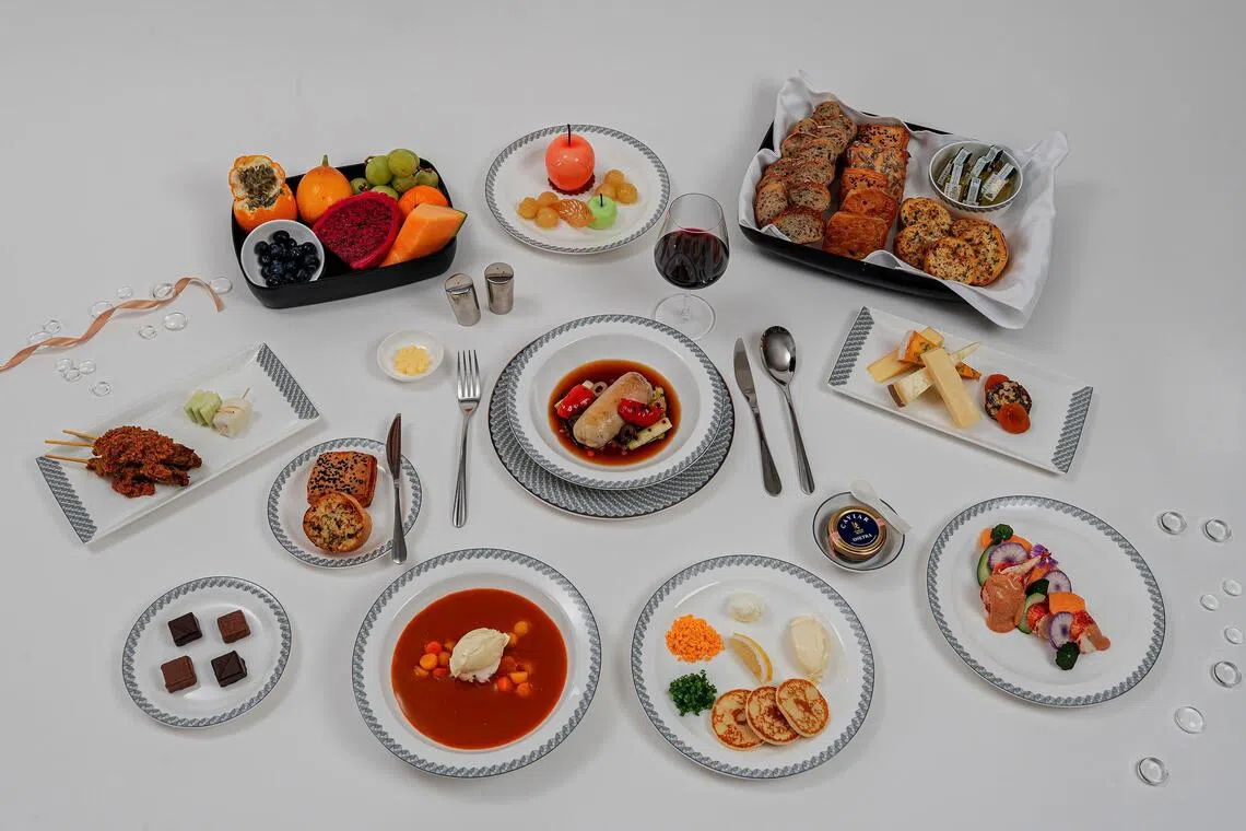 The new menu offerings for first-class passengers include a lobster royale appetiser, lobster bisque soup, sous-vide chicken thigh roulade with chicken and pearl barley broth, and apple trompe-l’ceil with granny smith sherbet and vanilla-poached apple dessert.