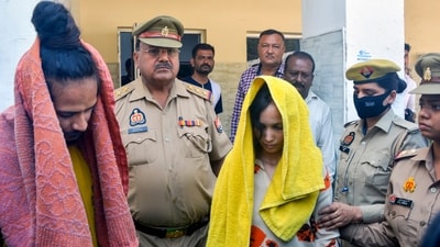 Police take away Merchant Navy officer Saurabh Rajput's wife Muskan and her lover Sahil Shukla after they were arrested in connection with his murder. (PTI)