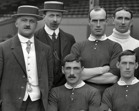 Manchester United’s players and staff pose for a group photo after winning the Division One title in 1908, the club’s first league title.