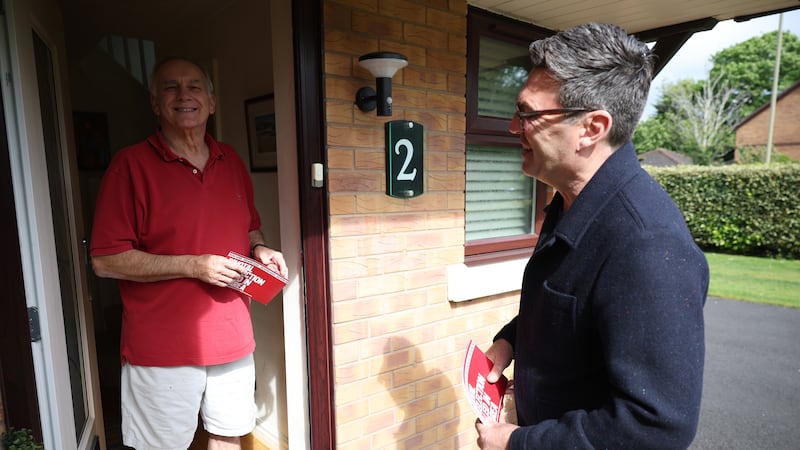 Mr Burnham speaks to a resident in Ashton-in-Makerfield as he goes door-to-door canvassing in May