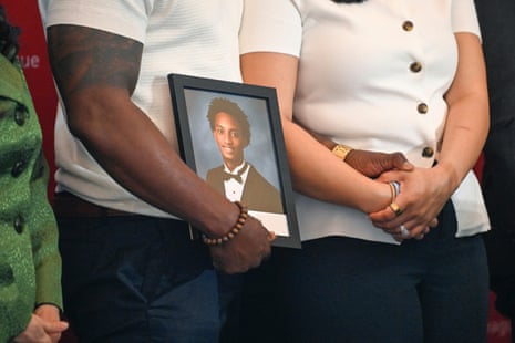 People hold picture of teenager